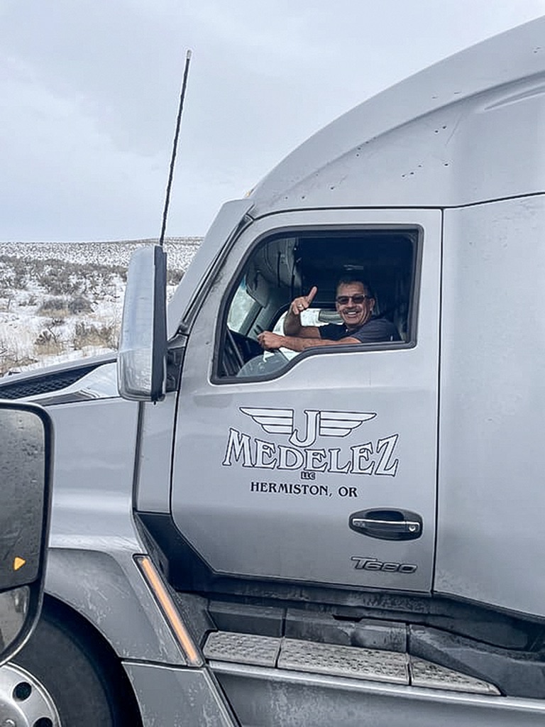 Alvaro Lamprea in the cab of his KJ Medelez truck